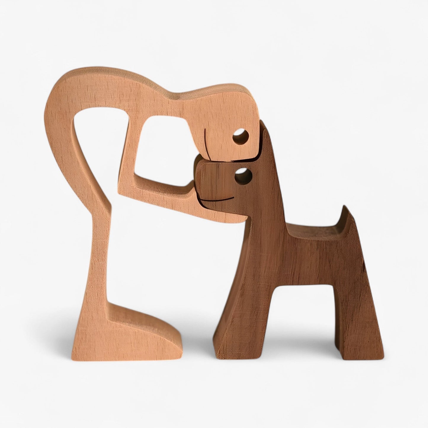 Holzschnitzerei von Mensch und Hund