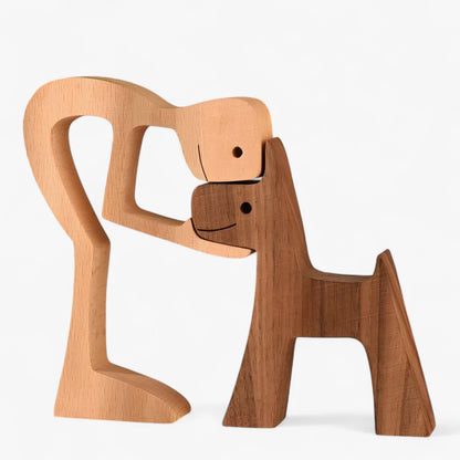 Holzschnitzerei von Mensch und Hund