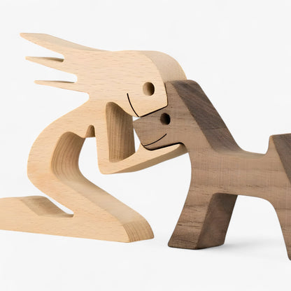 Holzschnitzerei von Mensch und Hund