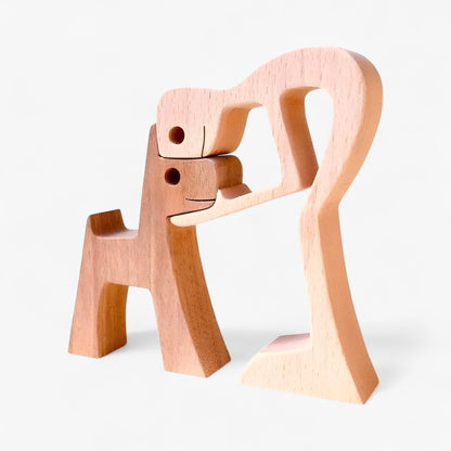 Holzschnitzerei von Mensch und Hund