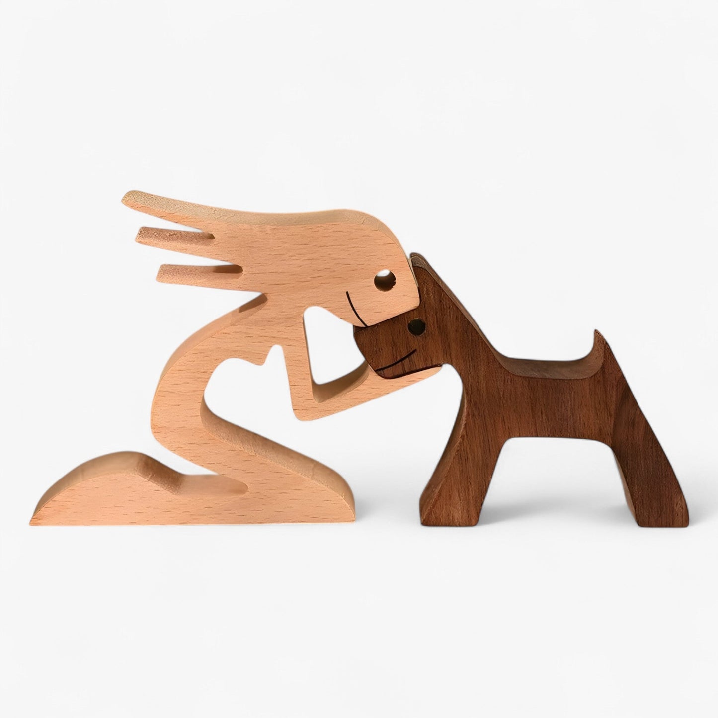 Holzschnitzerei von Mensch und Hund