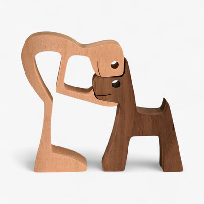 Holzschnitzerei von Mensch und Hund
